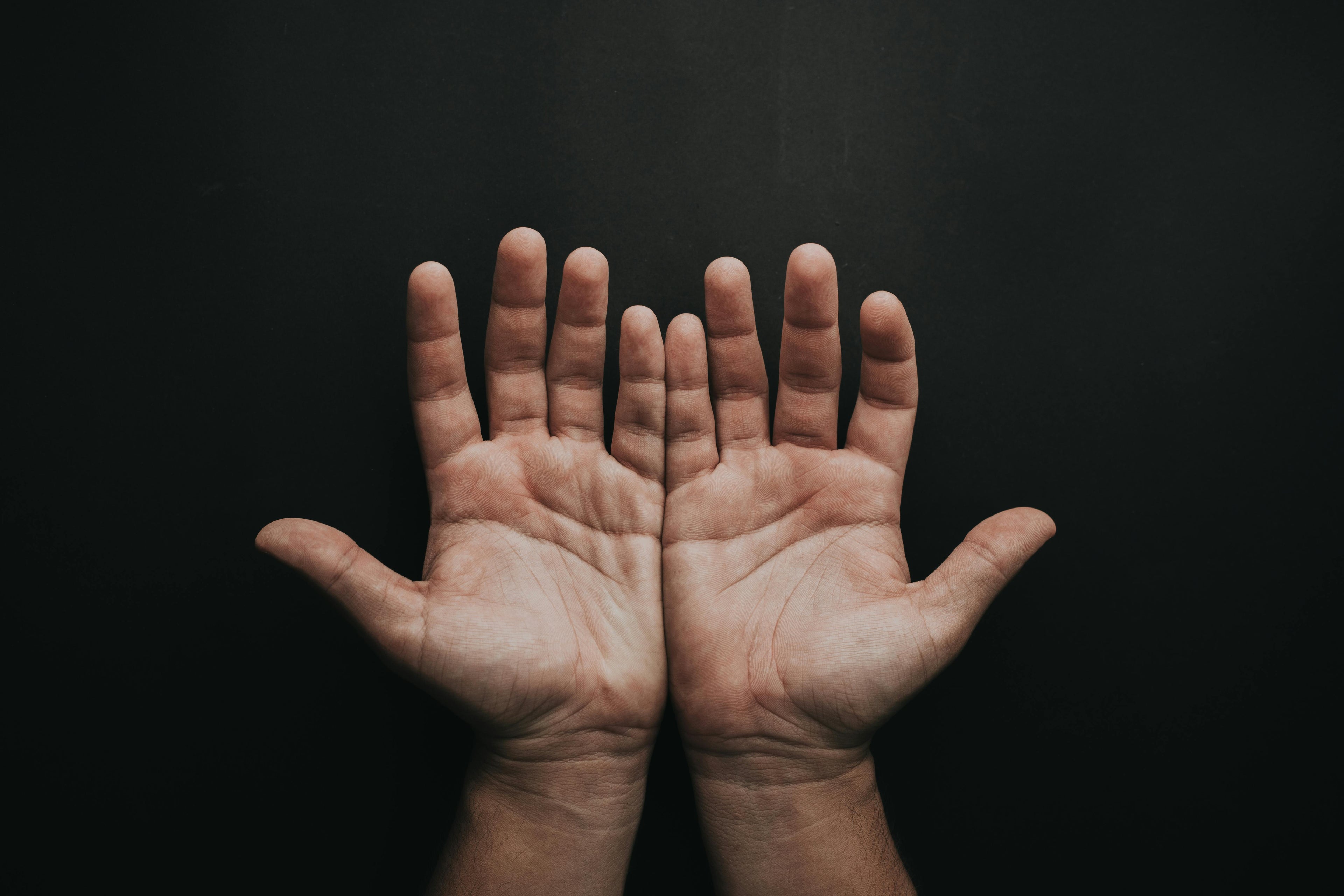 a man holding out both his hands