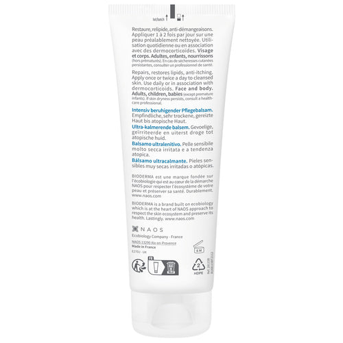 Back label of a skincare product container with text and icons on a white background