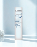 Bioderma Atoderm Stick Levres on a light blue background