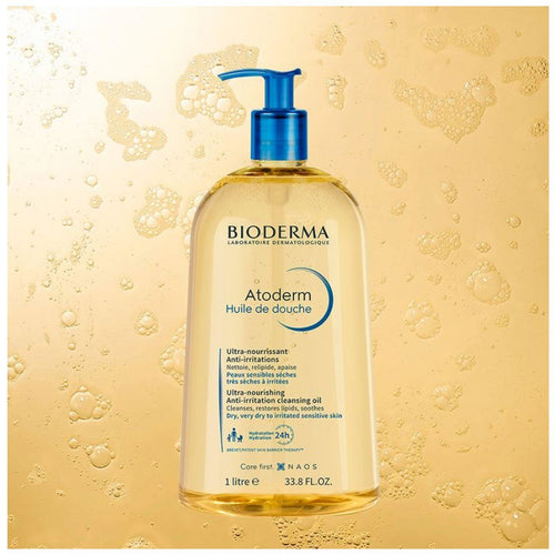 Bioderma Atoderm shower oil bottle with pump on a yellow background