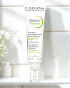 Bioderma Sébium Kerato+ skincare product on a white surface with a blurred background
