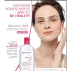 Bioderma Sensibio H2O product with a woman touching her face on a white background