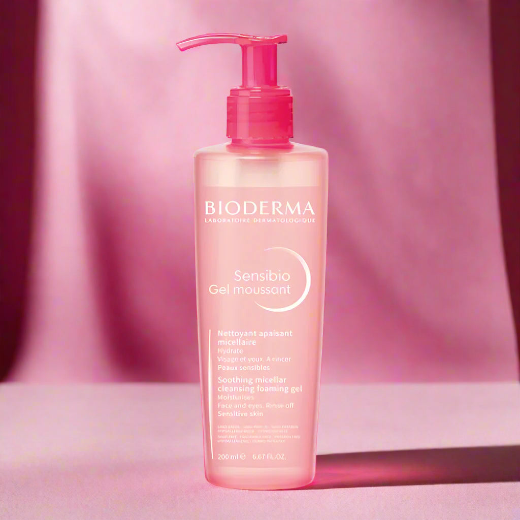 Bioderma bottle with pink pump on a white background