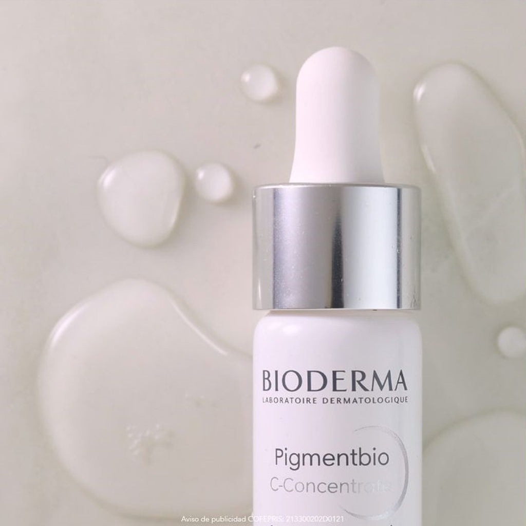 Bioderma skincare bottle with dropper on a textured beige background