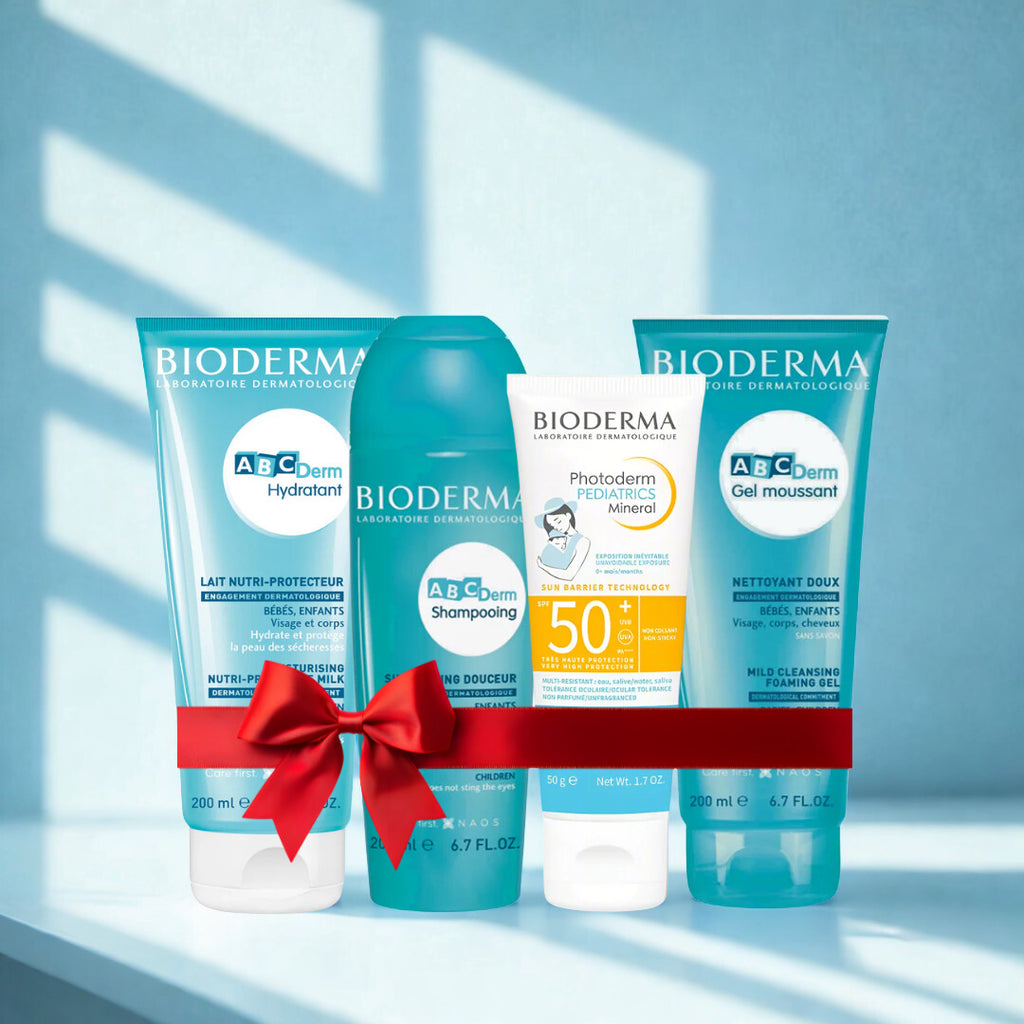 Bioderma skincare products with a red bow on a light blue background