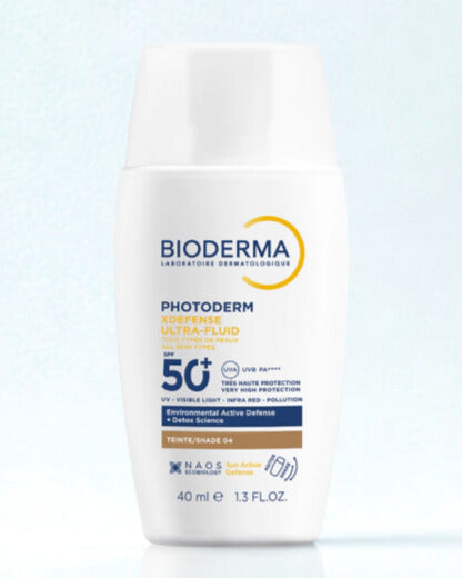 Bioderma sunscreen bottle on a light blue background