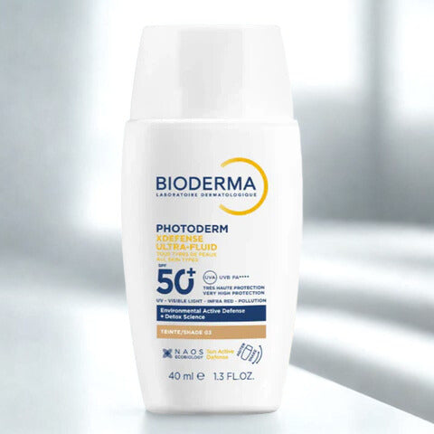 Bioderma sunscreen bottle on a reflective surface