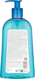 Blue bottle with pump and label on a white background