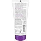 Back view of a purple skincare product tube with text and labels on a white background