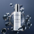 Institut Esthederm Age Proteom Advanced Serum surrounded by bubbles on a dark background