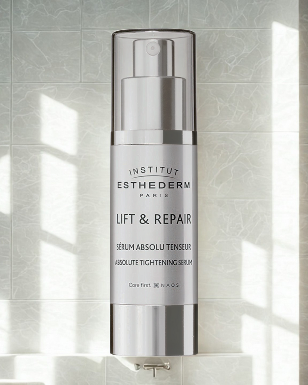 Institut Esthederm Lift & Repair serum bottle on a light gray tiled background