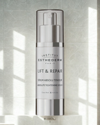 Institut Esthederm Lift & Repair serum bottle on a light gray tiled background