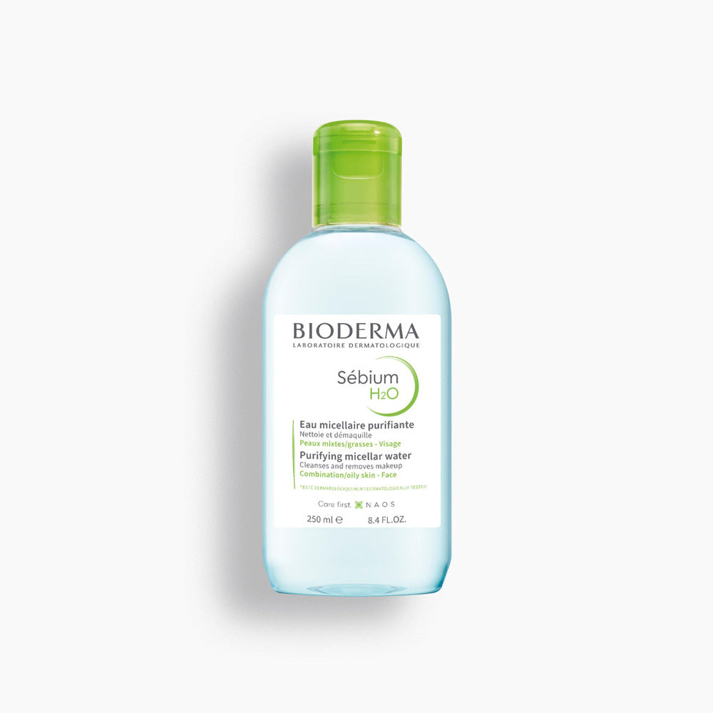 Bioderma bottle with green cap on a white background