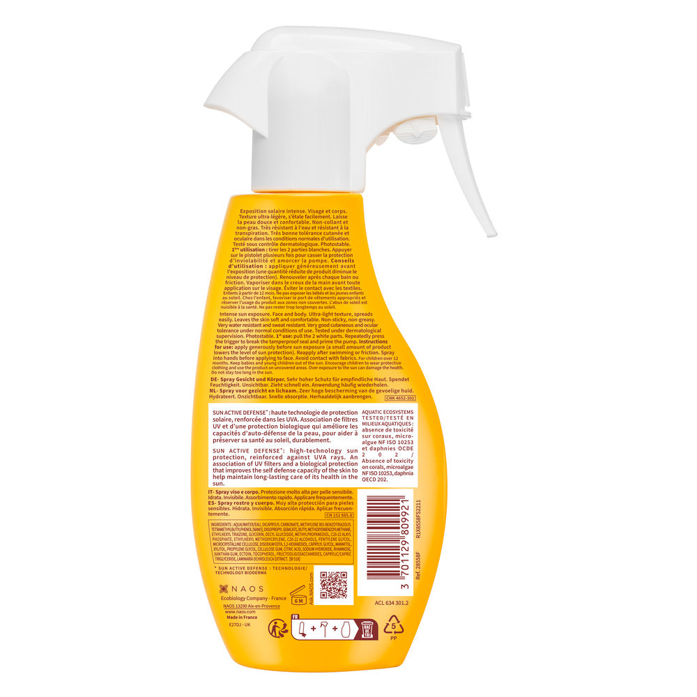 Yellow spray bottle with a white nozzle on a white background