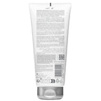 Back view of a skincare product tube with text and branding on a white background