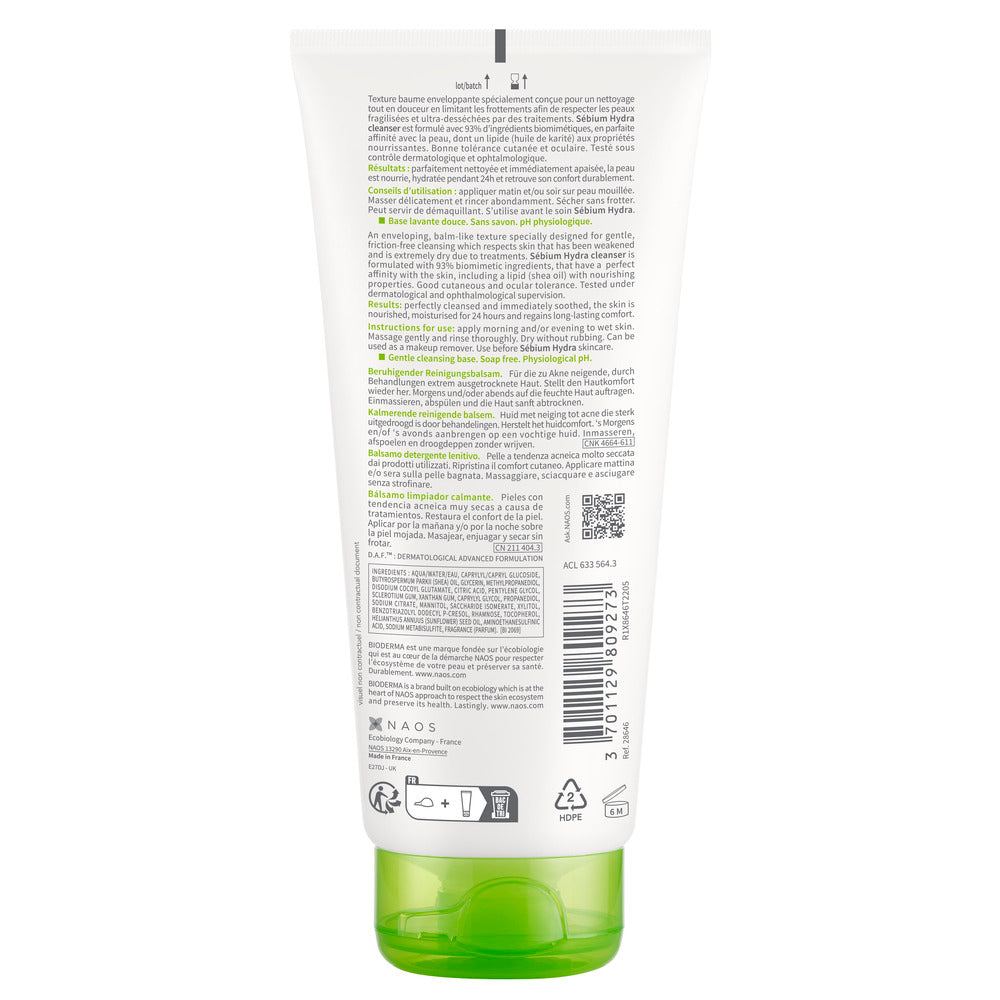 Back view of a green skincare product tube with text and symbols on a white background