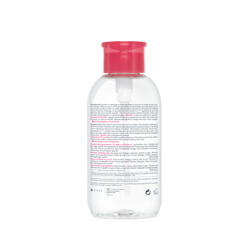 Clear bottle with a red cap on a white background