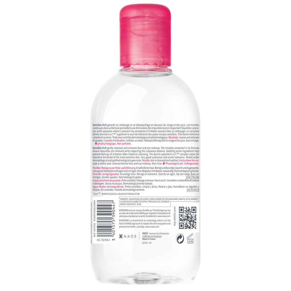 Clear bottle with pink cap on a white background