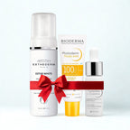 Three skincare products with a red bow on a white background