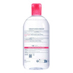 Clear bottle with pink cap on a white background